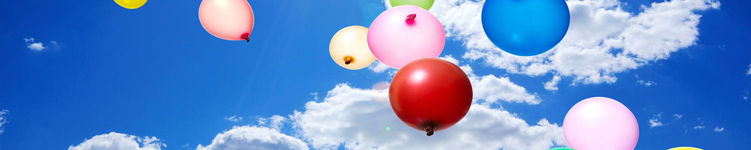 Photo of helium balloons against the sky