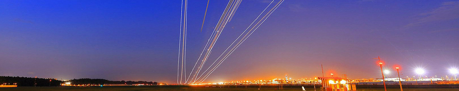 Photo of lightstreams in the night sky created by passing aircraft