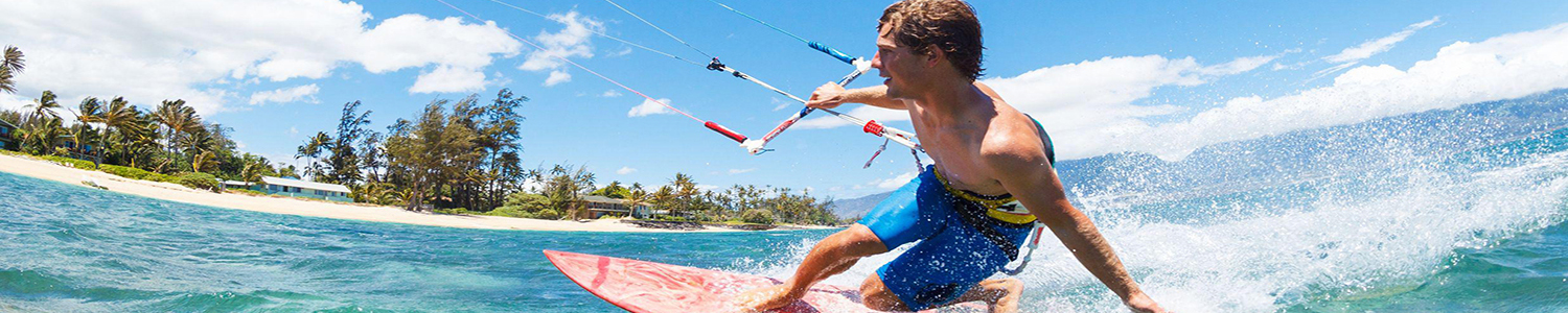 Photo of a man kitesurfing